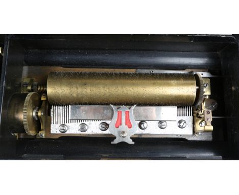 A 19th century Swiss musical box, the lever wind mechanism playing eight airs on a 23.4cm cylinder, the tune sheet and moveme
