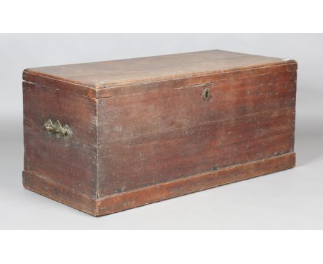 An early 19th century oak trunk with hinged lid and brass handles, height 55cm, width 122cm, depth 56cm.Buyer’s Premium 29.4%