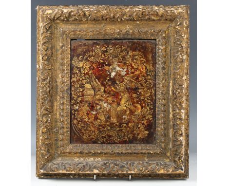 An 18th century Italian reverse gilded and red painted glass panel, finely decorated with a vignette view of The Annunciation
