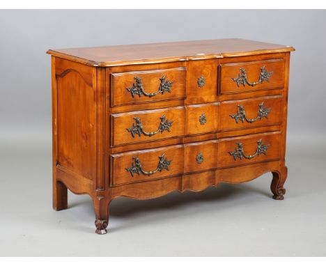 A 20th century French cherry serpentine fronted four-drawer commode, height 87cm, width 128cm, depth 53cm.Buyer’s Premium 29.