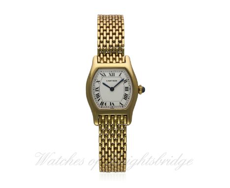 A FINE LADIES 18K SOLID GOLD CARTIER PARIS TORTUE BRACELET WATCH CIRCA 1970s
D: Silver dial with black Roman numerals, secret