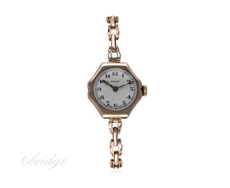 A LADIES 9CT SOLID ROSE GOLD ROLEX BRACELET WATCH CIRCA 1920s
D: White enamel dial with Arabic numerals, outer minute track. 