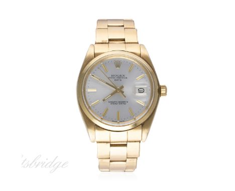 A RARE GENTLEMAN'S SOLID GOLD ROLEX OYSTER PERPETUAL DATE BRACELET WATCH CIRCA 1978, REF. 1500 
D: Silver dial with gold bato