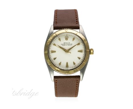 A GENTLEMAN'S STEEL & GOLD ROLEX OYSTER PERPETUAL TURN O GRAPH WRIST WATCH CIRCA 1953, REF. 6202
D: Silver "honeycomb" dial w