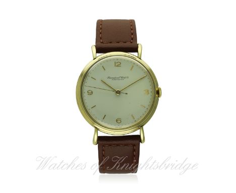 A GENTLEMAN'S 18K SOLID GOLD IWC WRIST WATCH CIRCA 1950s
D: Silver dial with gilt Arabic numerals & markers. M: Manual wind m