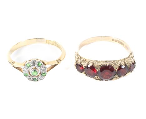 A 18ct gold peridot and diamond set dress ring, size O and a 9ct gold garnet set dress ring size N