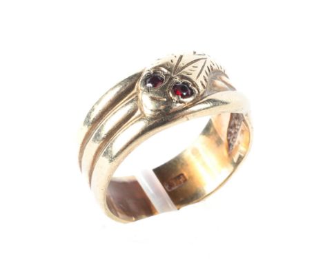 A 9ct yellow gold ring in the form of a snake, the eyes set with gems, ring size P/Q, 5.8g