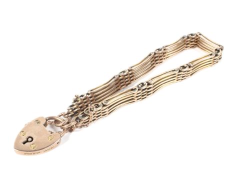 A 9ct gold gate bracelet, with lock and safety chain, 22.8g