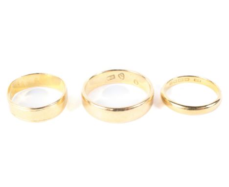 Two 22ct gold wedding bands 11 grams  and a yellow metal ring 4 grams (possibly unmarked gold)