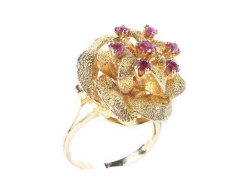 A ladies 9ct gold dress ring, in form of a stylised flower, set with seven stones, ring size P, 8.4g