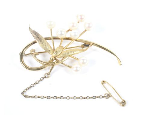 A yellow metal and pearl brooch, marked 14k, with safety chain, 6.2g