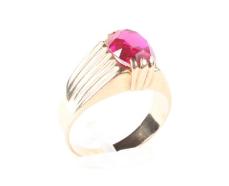 A gentleman's gold ring, stamped 583 set with a Burma ruby, 5.4 grams, size R