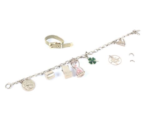 A 9ct gold charm bracelet with an assortment of eight charms, including a miniature dice, an egg turner etc, 11.6g and a gilt