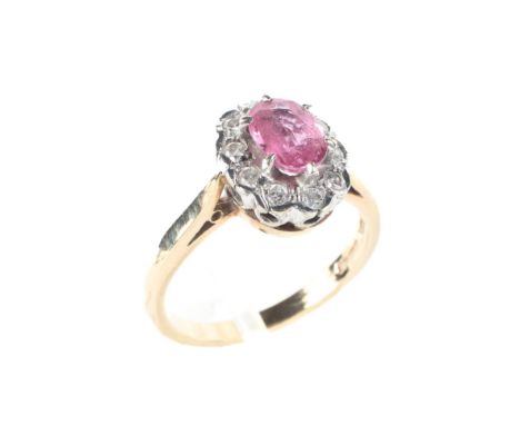 A 9ct gold daisy pink sapphire and diamond dress ring, the central stone surrounded by diamonds, size N, weight 3.6 grams