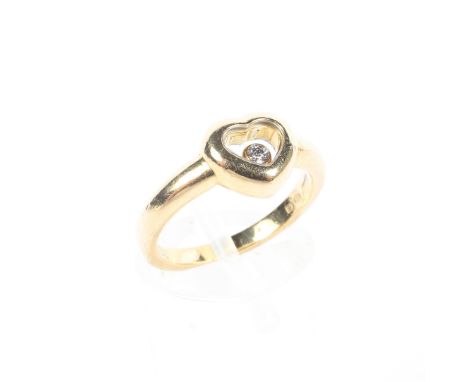 An 18ct gold floating diamond ring, ring size I, 4.8g