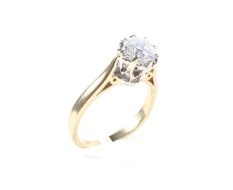  An 18ct diamond solitare ring, set in a raised claw mount with raised shoulders, the brilliant cut diamond measuring approxi