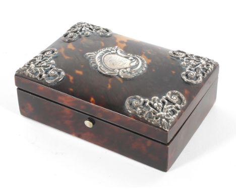 A Victorian tortoiseshell ring box, hallmarked for Chester, 1894, with pierced silver corner mounts and central plaque monogr