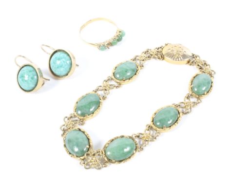 A 14k gold and jade bracelet, with six oval polished jade stones mounted in 14k gold and faux jade set earrings on circular f