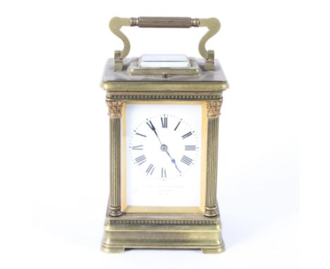 A Goldsmiths and Silversmiths Company brass striking carriage clock in leather case, with white enamelled dial and black Roma