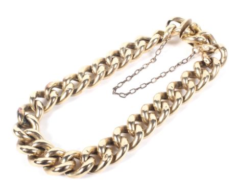 An 18ct gold curb link bracelet with safety chain links, stamped '18', 13.9g