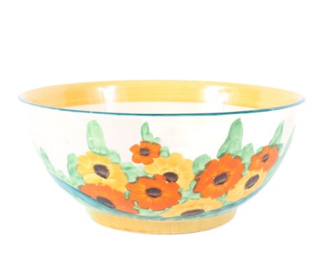 A Clarice Cliff Bizzare bowl, circa 1930s, printed black Wilkinson Ltd marks, painted with yellow and orange flowers in a con
