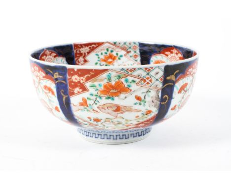 A 19th/20th century Japanese imari bowl decorated with reserves of birds and foliage, a seascape scene to the centre, Fuku ma