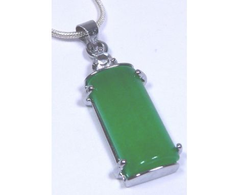 SILVER & JADE PENDANT. Silver and jade pendant on a sterling silver snake chain CONDITION REPORT: The pendant mount is marked