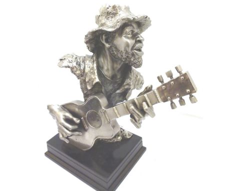 GUITAR PLAYING FIGURE. Cast white metal model of guitar playing figure