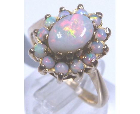 OPAL CLUSTER RING. 9 ct gold opal cluster ring, size K