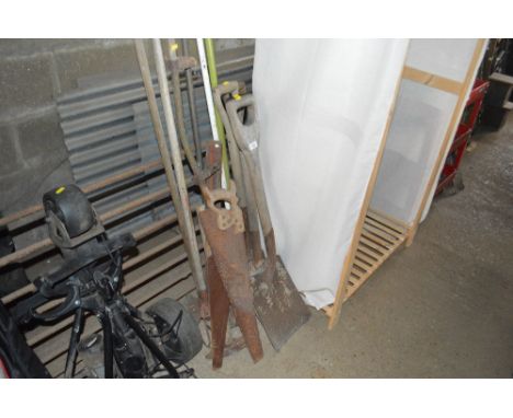 A quantity of long handled gardening tools