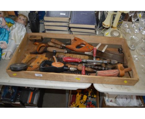 A wooden tray of various hand tools