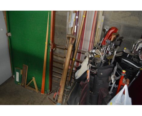 A quantity of long handled gardening tools