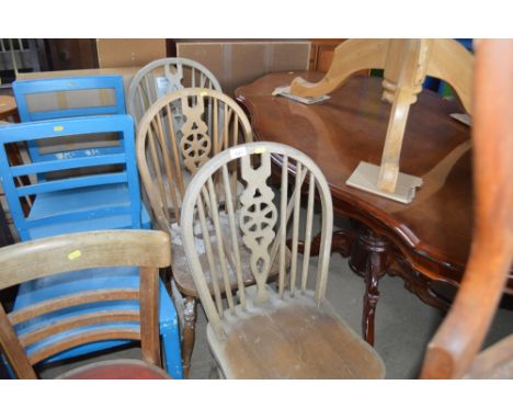 A set of three stick and wheelback dining chairs 