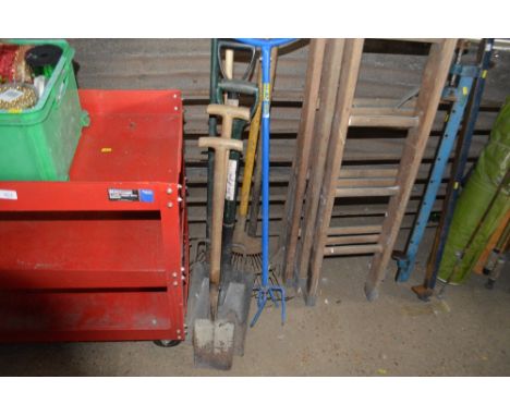A quantity of long handled gardening tools