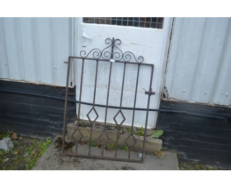 A wrought iron garden gate