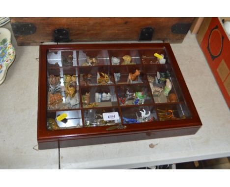 A display case and contents of various Wade Whimsy's etc.