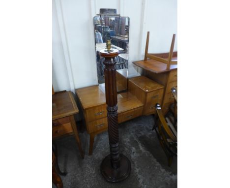 A carved mahogany torchere converted to standard lamp 