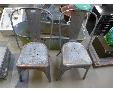 A pair of vintage steel stacking chairs 