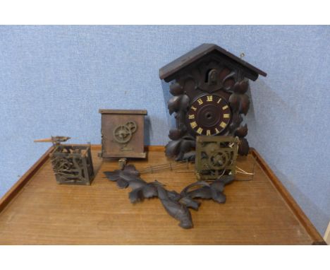 A cuckoo clock and two cuckoo clock movements 