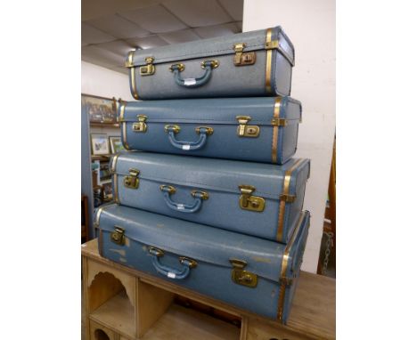 A vintage set of four graduated cases 
