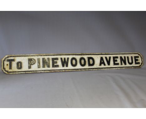A VINTAGE CAST METAL STREET SIGN  'TO PINEWOOD AVENUE',  W 147 cm