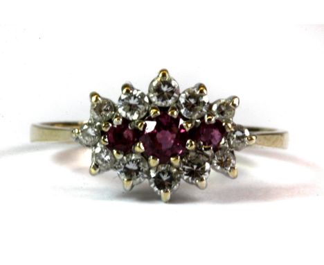 A 9ct yellow gold ruby and cubic zirconia cluster ring (O).