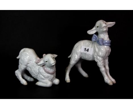 A pair of Lladro porcelain figures, Little Boy Lamb and Little Girl Lamb, both 17cm high and with original boxes.