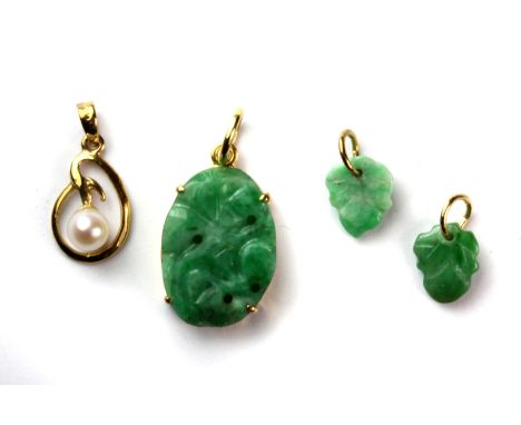 Three 14ct yellow gold (stamped 14k) mounted jade pieces together with a 14ct yellow gold and pearl pendant.