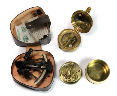 A cased miniature Marine sextant, brass compass and a reproduction 1911 Stanley of London brass sextant.