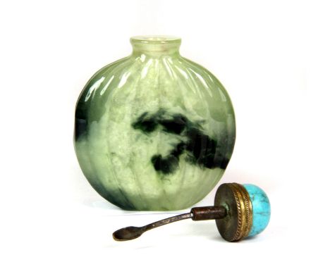 A superb 19th / early 20th century Chinese melon shaped jade snuff bottle with a natural dragon head and body in the colourin