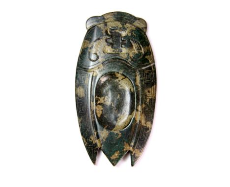 A Chinese carved dark green jade inkstone in the form of Cicada, L. 14cm.