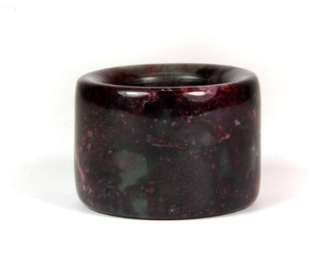An interesting mixed coloured jade archers ring. Dia. 3.5cm.