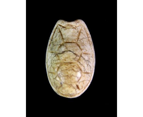 An ususual Japanese 19th century carved white hardstone netsuke in the form of a turtle shell. L. 5.5cm.