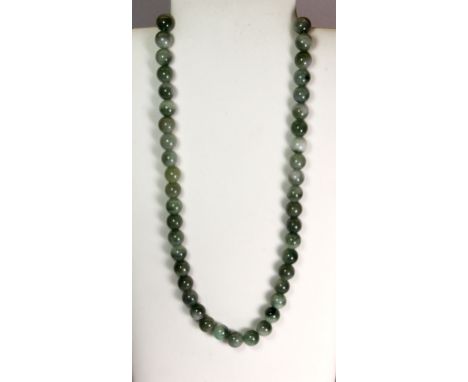 A single strand of 13mm mixed coloured jade beads. Necklace length 26" / 66cm.
